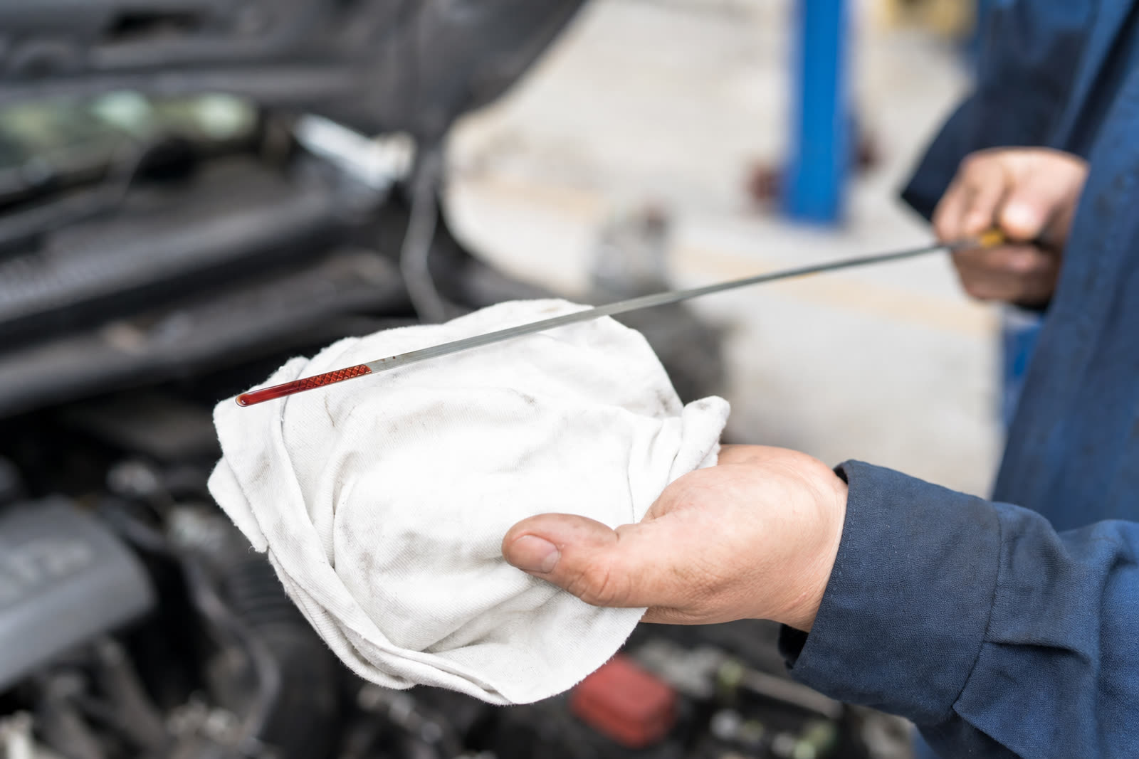 Perry's Quality Auto mechanic checking automatic transmission fluid on a vehicle in Simi Valley